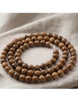 Image de Fil de Perles - Bois Fossile - 6 mm depuis Achetez vos pierres et toute la Lithothérapie ici – Pierres naturelles et bijoux authentiques (2)